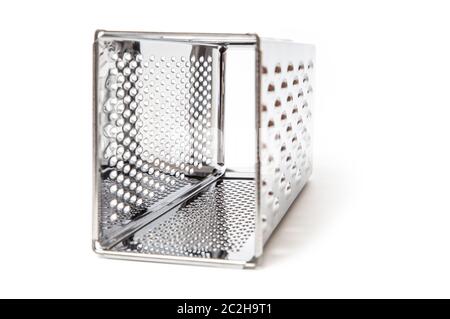 Grater blade. Texture of the chrome metal blades. Inside view of the tool close up Stock Photo