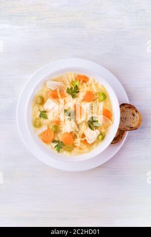 Chicken noodle soup, shot from the top with a place for text Stock Photo