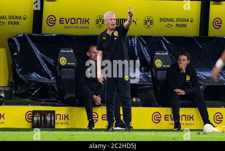 Dortmund, Germany. 17th June, 2020. Football: Bundesliga, Borussia Dortmund - FSV Mainz 05, 32nd matchday at Signal Iduna Park. Dortmund coach Lucien Favre stands at the coach's bench and gives instructions. Credit: Guido Kirchner/dpa-pool/dpa - IMPORTANT NOTE: In accordance with the regulations of the DFL Deutsche Fußball Liga and the DFB Deutscher Fußball-Bund, it is prohibited to exploit or have exploited in the stadium and/or from the game taken photographs in the form of sequence images and/or video-like photo series./dpa/Alamy Live News Stock Photo