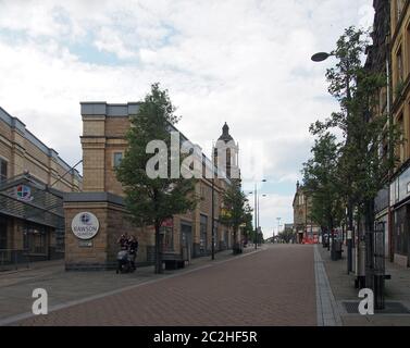 people walking in the street in the rawson quarter area of bradford Stock Photo