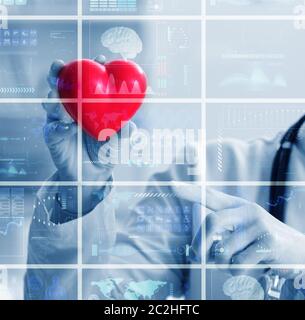 The woman doctor in telemedicine cardiology concept Stock Photo