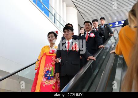 Pyongyang, North Korea - April 29, 2019: Korean newlyweds couple in Pyongyang International Airport Stock Photo