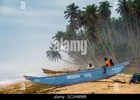 Fishing boats on Kengen beach on the west coast in Ghana, Africa Stock Photo