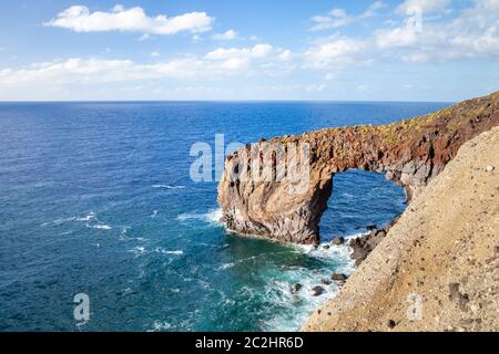 rock arch Punta Perciato Stock Photo