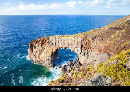 rock arch Punta Perciato Stock Photo