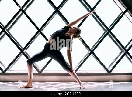 Group of women doing yoga in Reverse Warrior pose - a Royalty Free Stock  Photo from Photocase