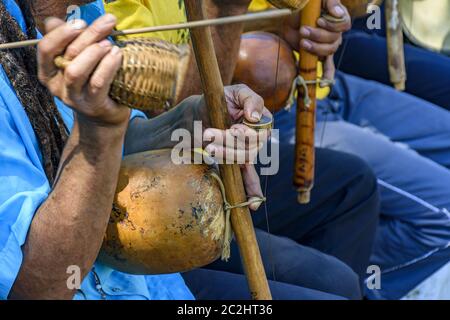 Traditional berimbau players during presentation of Brazilian capoeira Stock Photo