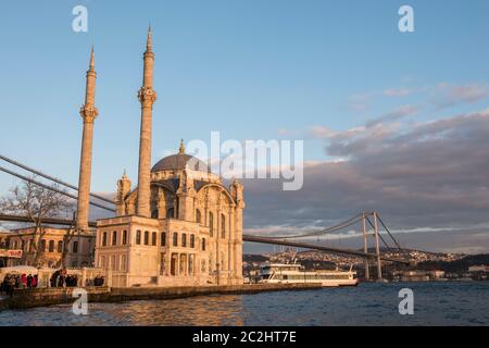 ISTANBUL, TURKEY - FEBRUARY 14, 2016: Ortakoy Mosque and Bosphorus Bridge in Istanbul, Turkey. Stock Photo