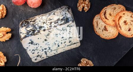 A panorama of Gorgonzola cheese, shot from above on a black background with copyspace Stock Photo