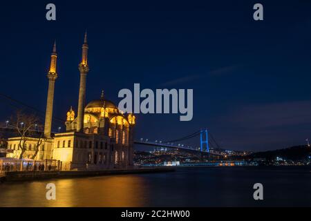 Ortakoy Mosque and Bosphorus Bridge (15th July Martyrs Bridge) night view. Istanbul, Turkey. Stock Photo