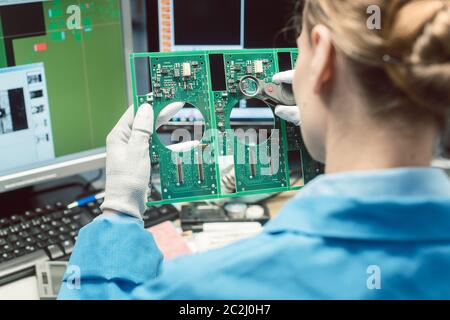 Optical quality control and assembly inspection of an electronic product in the factory Stock Photo