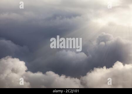 Dramatic clouds with sunlight beams poking though. Natural cloudscape backgorund Stock Photo