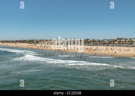 People enjoying a summer day at Huntington Beach Stock Photo