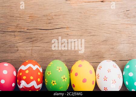 Beautiful Easter multi color egg on wooden background, Easter day concept Stock Photo