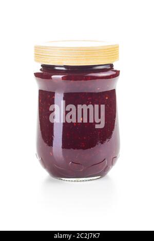 Raspberry jam in jar isolated on white background. Stock Photo