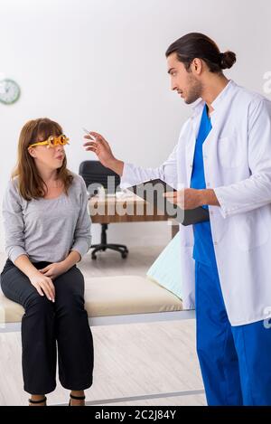 Young woman visiting doctor oculist Stock Photo