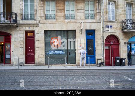 A store selling and dealing with cryptocurrencies in front of the tram lines in Bordeaux City, France August 2019 Stock Photo