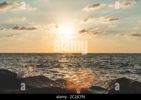 The scenic sunset over the Mediterranian Sea as seen from a beach in Tel Aviv, Israel Stock Photo