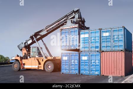 Cargo forklift handling container loading box export industrial Stock Photo