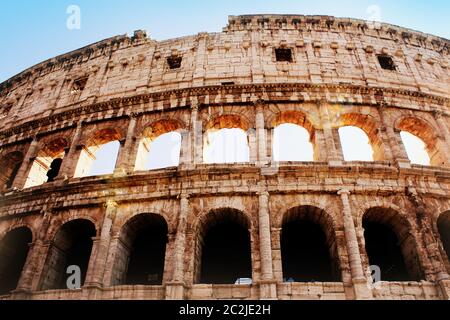 The iconic ancient Colosseum of Rome. View in sunrise . Stock Photo