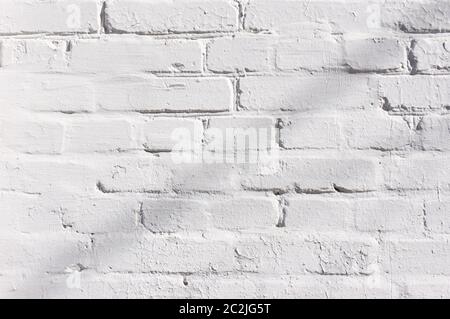 Abstract weathered texture stained old stucco light gray and aged paint white brick wall background in rural room, grungy rusty Stock Photo