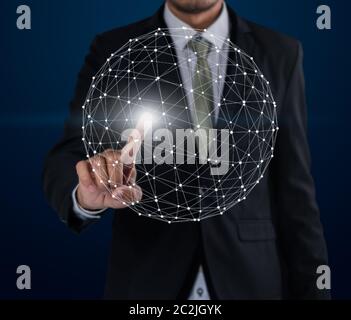 Business man touch networking technologies and social interaction on dark blue background Stock Photo