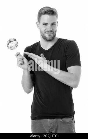 Candy made for love. Handsome guy show candy with love word lettering. Unshaven bachelor hold candy on stick. Candy shop. Valentines day lollipop or sucker. Sugary treat for your Valentine. Stock Photo