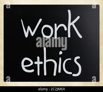 'Work Ethics' handwritten with white chalk on a blackboard Stock Photo