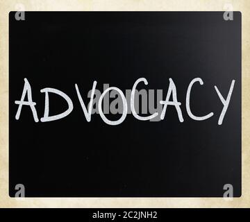 The word 'Advocacy' handwritten with white chalk on a blackboard Stock Photo