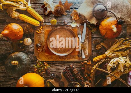 Thanksgiving dinner. Autumn fruit with plate and cutlery. Thanksgiving autumn background Stock Photo
