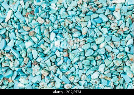 Small rounded turquoise stones textured background Stock Photo
