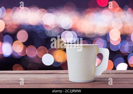 Paper cup coffee on the wooden table with bokeh background Stock Photo