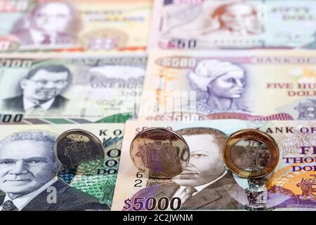 Jamaican coins on the background of banknotes Stock Photo