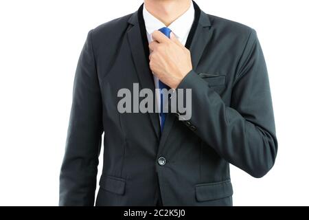 Businessman adjusting necktie isolated on over white background Stock Photo
