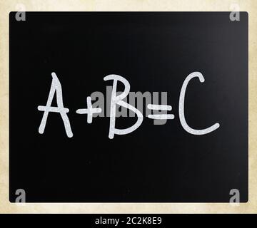 A+B=C handwritten with white chalk on a blackboard Stock Photo