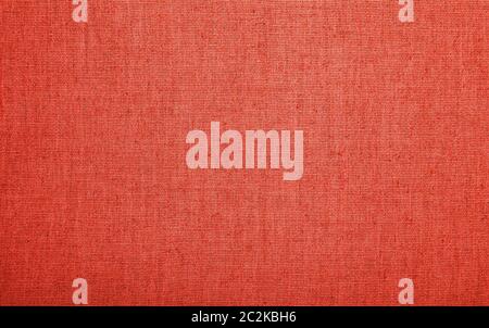 Red and coral pink colored burlap jute sackcloth bagging canvas texture pattern background Stock Photo