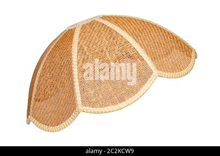 Lamp shade isolated. Close-up of vintage wicker lamp shade in side view isolated on a white background. Interior decoration element. Stock Photo
