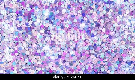 Real shiny heart-shaped sparkles textured background Stock Photo