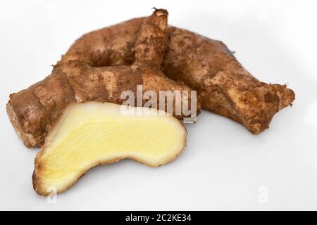 Mango-Ginger rhizome (Curcuma mangga) rhizome whole and sliced on a white background