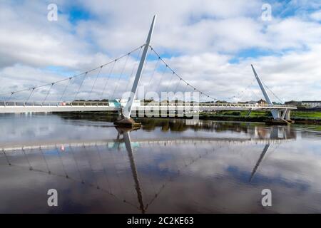 The Peace Bridge over the river Foyle in Derry, Northern Ireland, UK, Europe Stock Photo