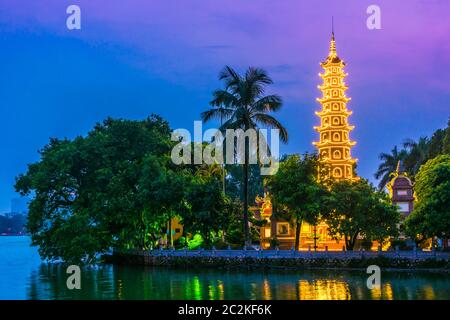 Tran Quoc Pagoda, the oldest Buddhist temple in Hanoi, Vietnam after sunset Stock Photo