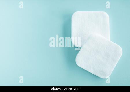 Organic cotton pads on mint background, cosmetics and make-up remover, hygiene and skincare beauty brand product for healthcare Stock Photo