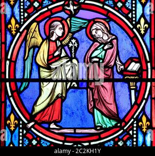 Nativity Window, stained glass by Oudinot of Paris, 1861, Feltwell Church, Norfolk. Annunciation by Archangel Gabriel to Virgin Mary Stock Photo