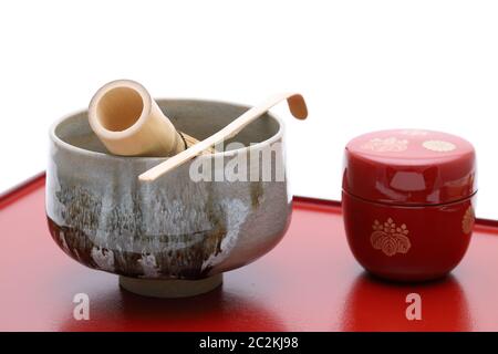 Tea bowl with tea whisk and bamboo spoon used in Japanese matcha green tea ceremony Stock Photo