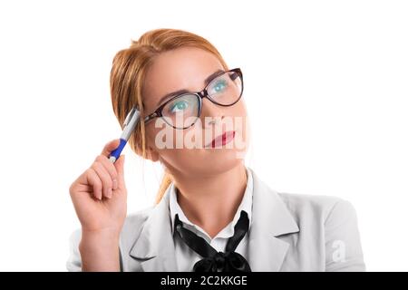Portrait of a young beautiful businesswoman with glasses holding a pen and thinking, looking for a solution to a problem, isolated on white background Stock Photo