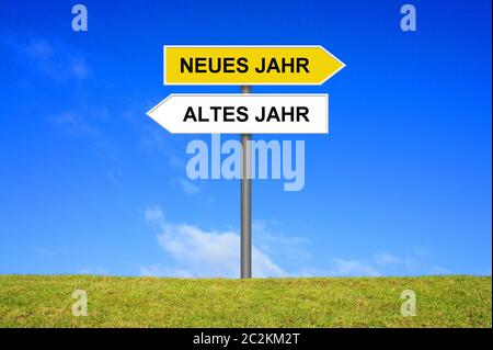 Signpost outside is showing Old year and New Year in german language Stock Photo