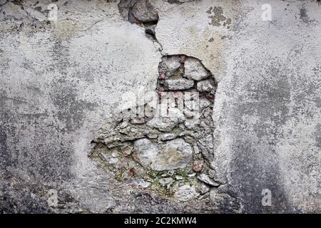 A dilapidated masonry. A broken wall on a building. Stock Photo