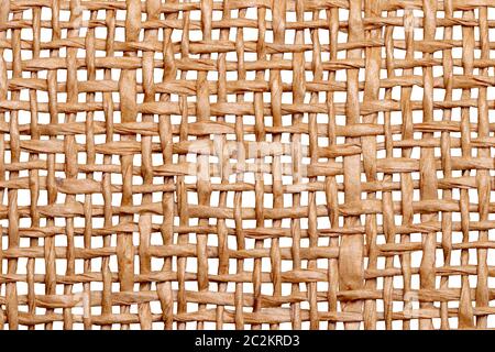 Wicker twigs texture isolated. Close-up of a detail of a handmade wicker lamp shade isolated on a white background. Macro. Stock Photo