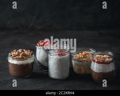 chia pudding set in different glass jars Stock Photo
