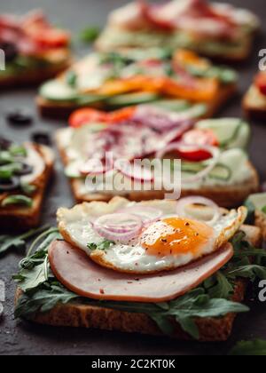 sandwiches with meat, egg, vegetables and herbs Stock Photo